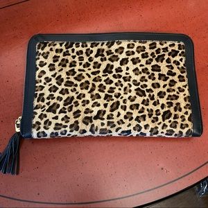 NWOT versatile, leather animal print clutch.